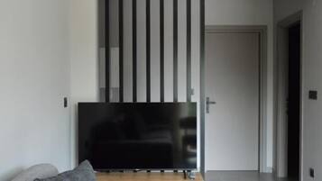 Luxury Apartment, 1 Queen Bed with Sofa bed, Balcony, Garden View | Living area | TV
