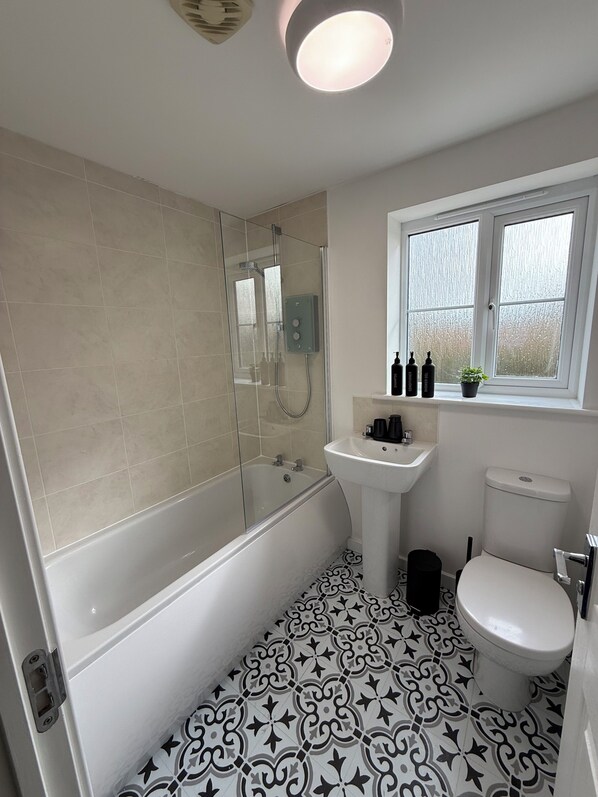 Shower, hair dryer, towels, soap