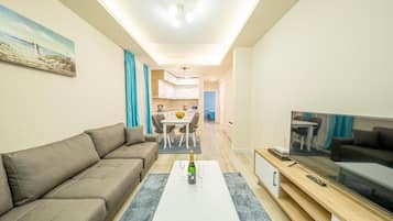Comfort Apartment, Sea View | Living area | 42-inch LED TV with satellite channels