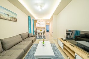 Comfort Apartment, Sea View | Living area | 42-inch LED TV with satellite channels - Seafront Apartments Petrovac (Petrovac)