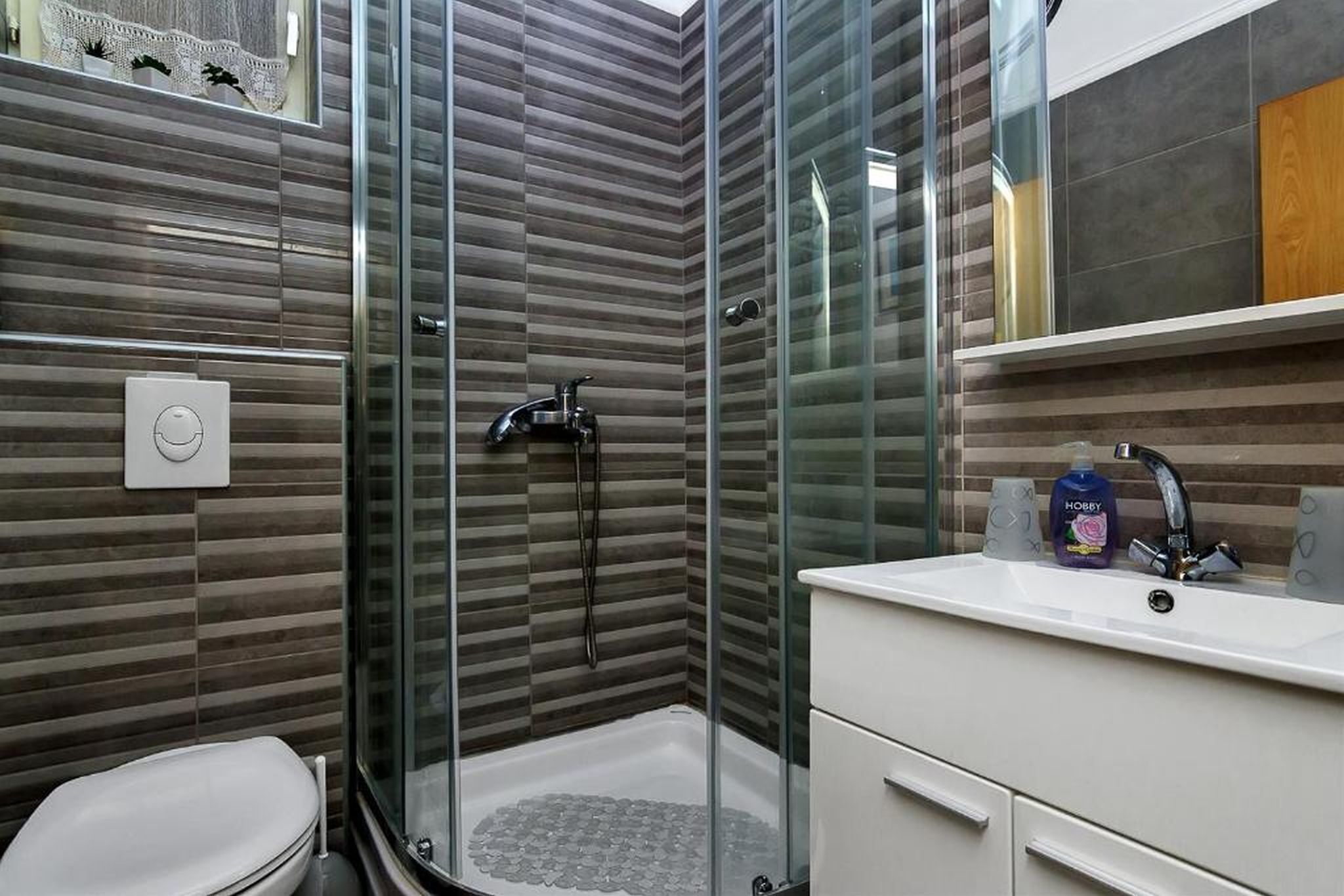 Apartment (A1) | Bathroom | Shower, towels, soap, toilet paper