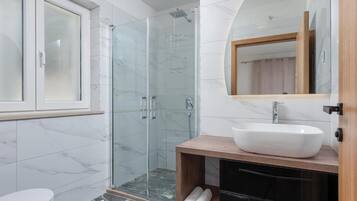 Villa | Bathroom | Shower, towels, soap, toilet paper