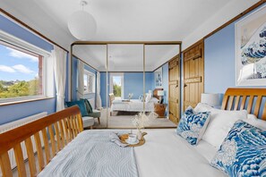 A room with a bed, a dining table, and a view of the outdoors. - Blue Haze, Charlestown (St. Austell)