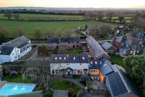 A residential area with houses, a swimming pool, and a large green field in the background. - The Old Chase, Chester (Chester)