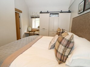 A bedroom with a bed, a desk, a chair, and a wardrobe. - Hilton, Appleby-In-Westmorland (Appleby-in-Westmorland)