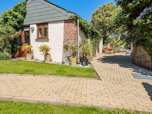 A house with a brick exterior, a tiled driveway, and potted plants. - Cameo, Bude, Cornwall (Bude)