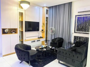 Apartament Deluxe, balcó, vistes a la ciutat | Sala d'estar