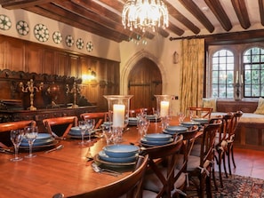 A dining room with a long wooden table set for a meal, surrounded by chairs. - Battel Hall, Hollingbourne (Maidstone)