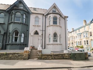A row of Victorian-style buildings with distinct architectural features, including arched windows and decorative stonework. - Apartment 2, Scarborough, 2bed (Scarborough)