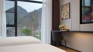 Deluxe Double or Twin Room, Lake View | Desk, laptop workspace, blackout drapes, soundproofing