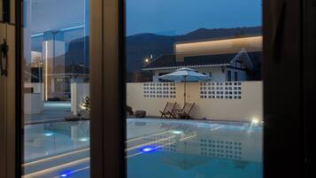 Outdoor pool, open 10:00 AM to 10:00 PM, pool loungers