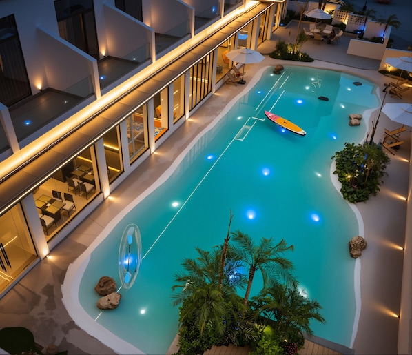 Outdoor pool, open 10:00 AM to 10:00 PM, pool loungers