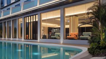 Outdoor pool, open 10:00 AM to 10:00 PM, pool loungers
