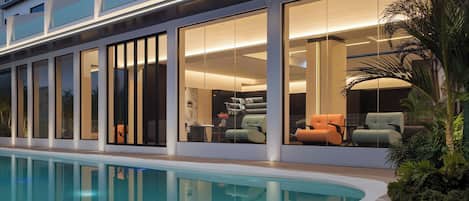 Outdoor pool, open 10:00 AM to 10:00 PM, pool loungers
