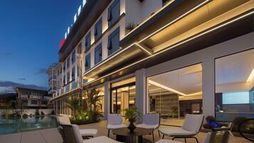 Outdoor pool, open 10:00 AM to 10:00 PM, pool loungers