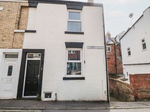A two-story building with a black door and windows, labeled 'ALBION-PLACE.' - 1 Albion Place, Whitby (Whitby)