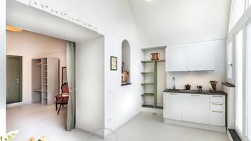 Deluxe-Apartment, Terrasse, Gartenblick | Innenbereich