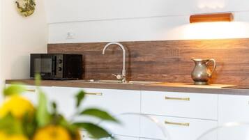 Superior-Apartment, Terrasse, Gartenblick | Eigene Küche