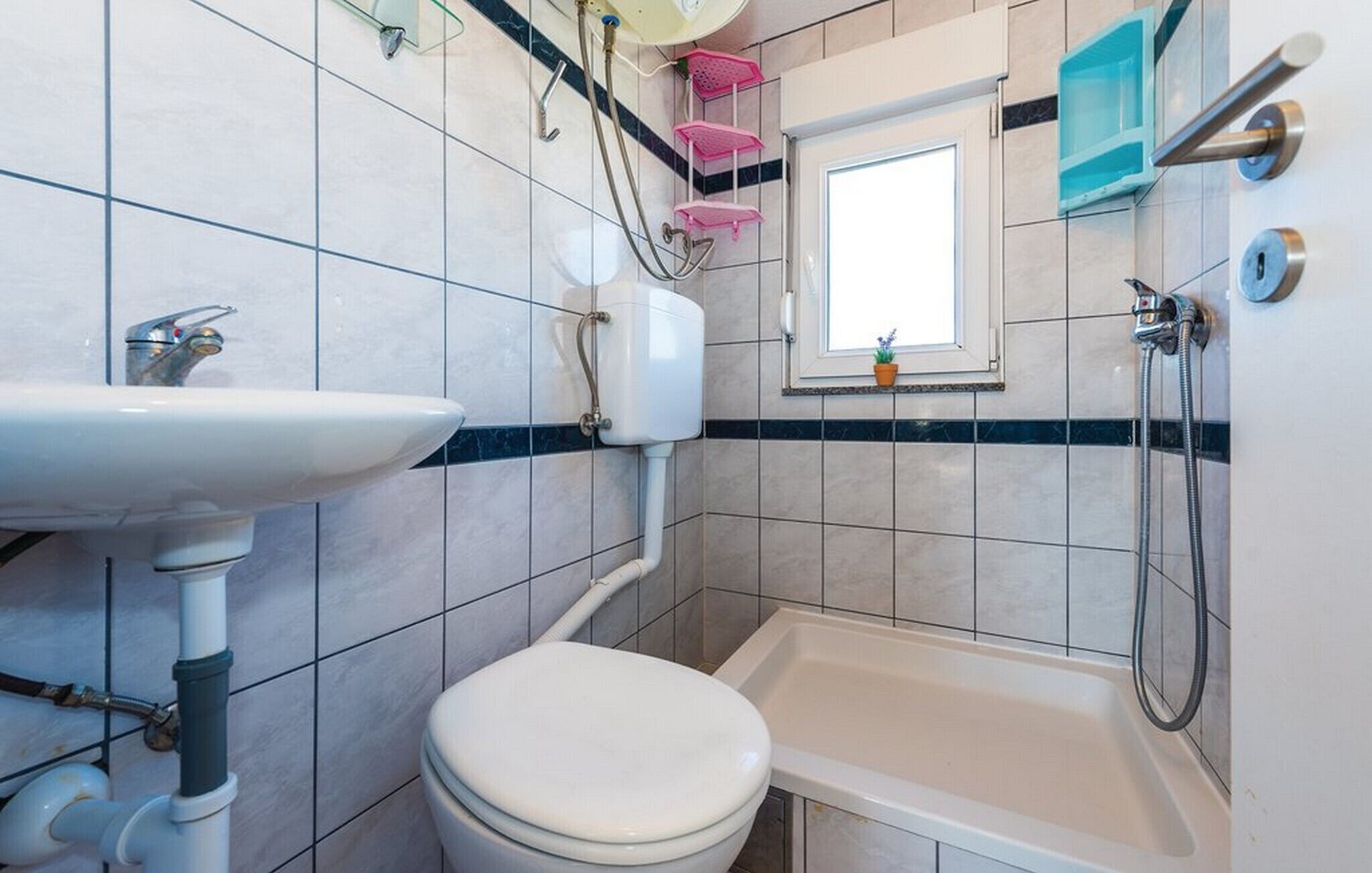 Shower, hair dryer, towels, toilet paper