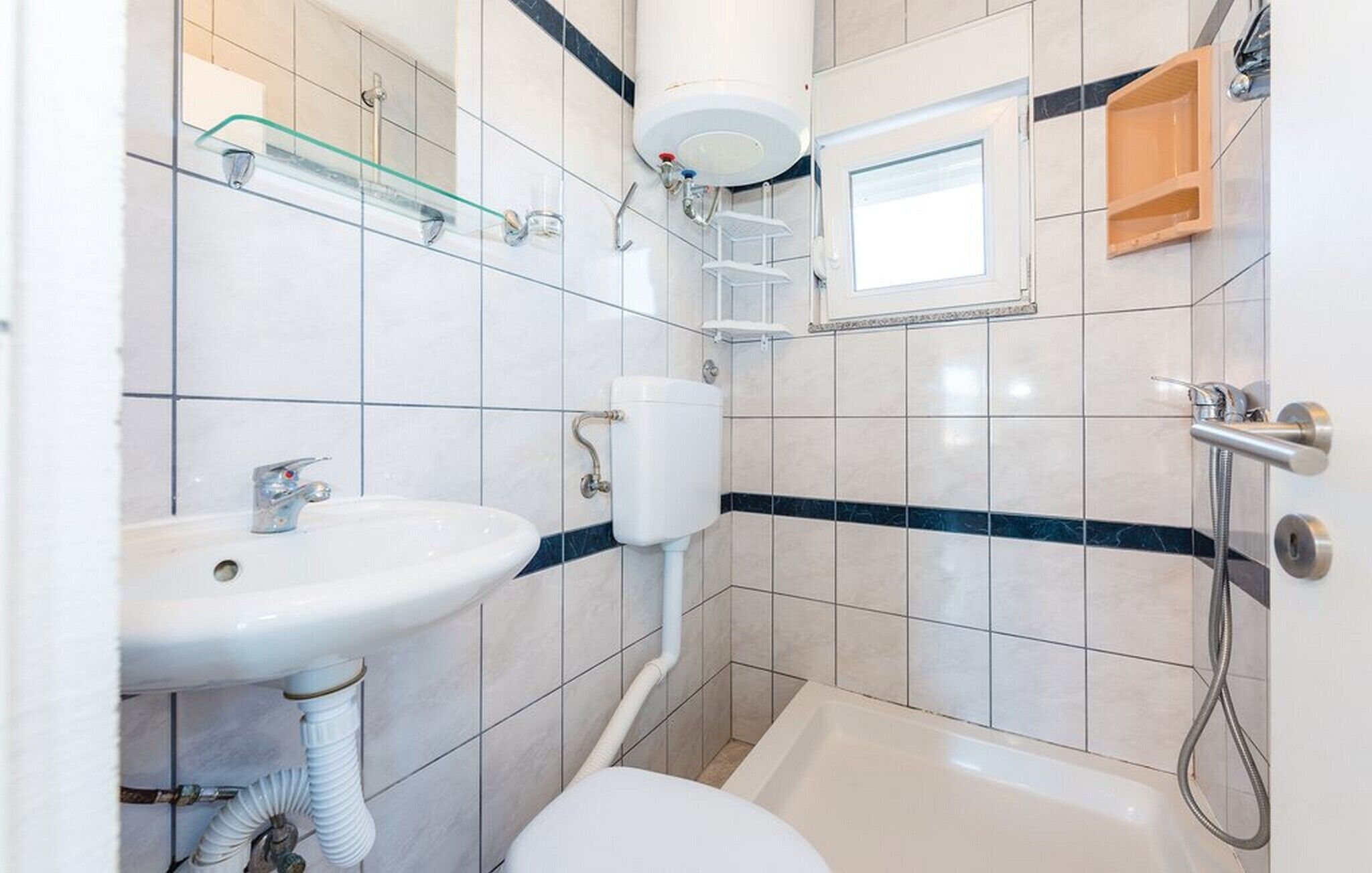 Shower, hair dryer, towels, toilet paper