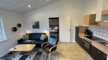 Comfort Apartment, Garden View | Living area