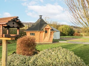 A wooden cabin with a conical roof, a small window, and a door. - 1 Gilpin House, Levens Cumbria (Kendal)