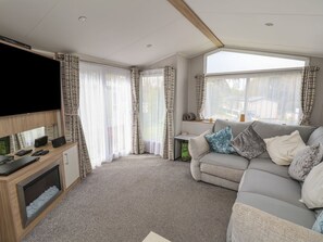 Living area - Woodlands Lodge, Bontuchel, Wales. TV (Ruthin)
