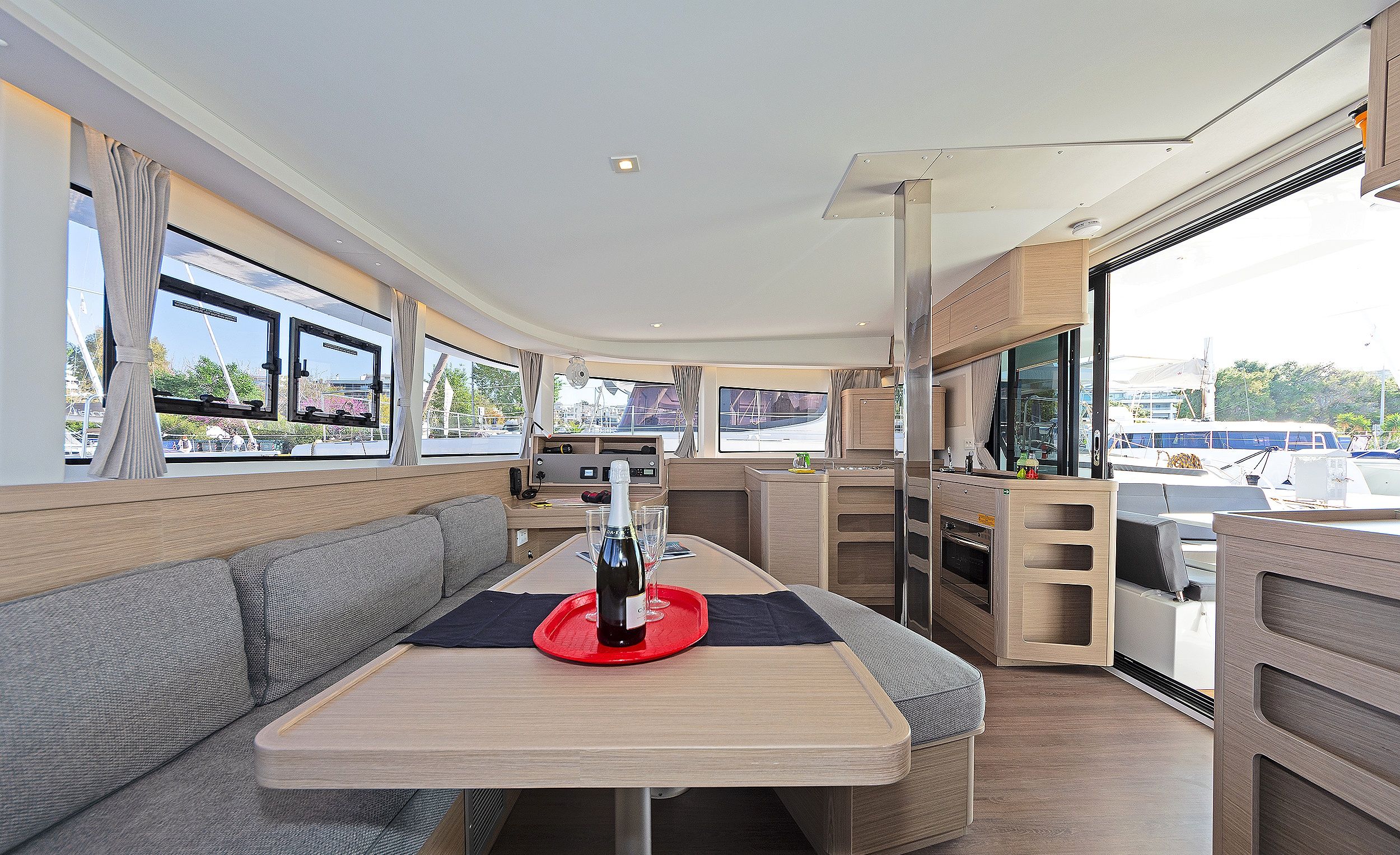 A compact kitchenette with a microwave, oven, and sink.