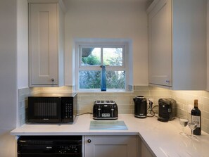 Dishwasher, high chair - Ayr Farmhouse, is in St Ives. (St. Ives)