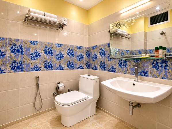 A bathroom with a toilet, sink, and shower. - Swaasha Vista (Kausani)