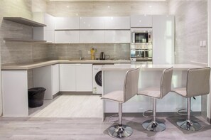 Departamento, vista a la ciudad | Cocina privada