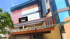 A multi-story building with a sign reading 'TOWNHOUSE Company-Serviced.' - Townhouse Birsa Railway Stadium Ranchi (Ranchi)