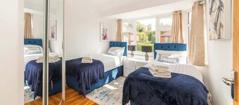 Spacious 4BR Home • Sleeps 8 • Free Parking