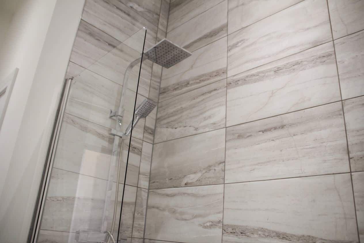 Shower, hair dryer, towels, shampoo