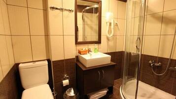 Shower, hair dryer, towels, shampoo