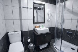 Shower, hair dryer, towels, shampoo
