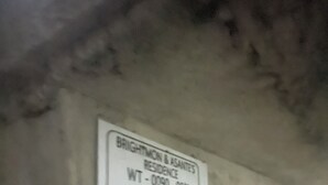 A sign with the text 'BRIGHTWOM & ASANTES RESIDENCE WT - 0090 - 0512 Ghana Post.'