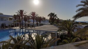 Indoor pool, outdoor pool, pool umbrellas, sun loungers