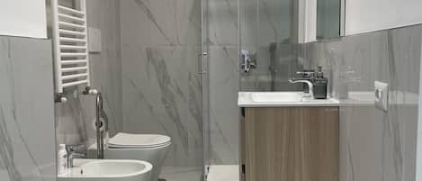 Hair dryer, bidet, towels, soap