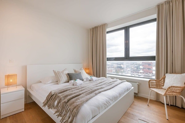 Bedroom with sunlight and gentle tones — wake up slow.