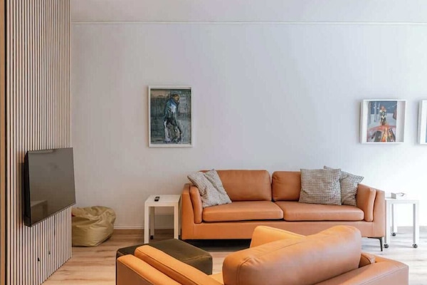 Enjoy a cozy and light-filled living area with modern finishes and a warm ambiance