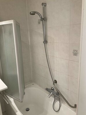 Shower, hair dryer, towels, shampoo