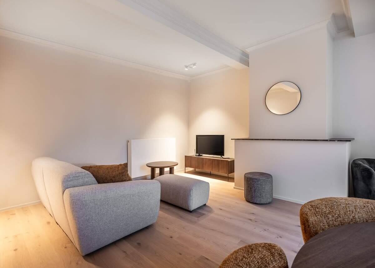 Modern living area with a comfortable sofa and a flat-screen television