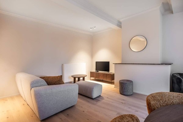 Modern living area with a comfortable sofa and a flat-screen television