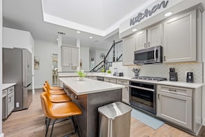 Gourmet kitchen with stainless appliances & fully stocked amenities for group cooking - Resort-Style Allen Home | Pool | Spa | Theater (allen)