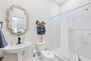 Shower, jetted tub, hair dryer, towels
