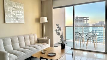 Apartment, Balcony, Partial Sea View | Living area | Flat-screen TV
