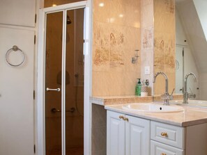 Shower, hair dryer, towels, soap