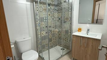 Shower, hair dryer, towels, soap