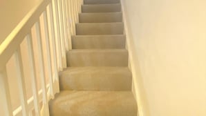 A staircase with carpeted steps and white railings. - London Luxe 5-bed House Retreat (London)